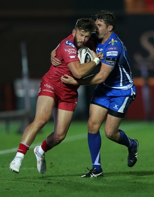 081016 - Scarlets v Newport Gwent Dragons - Guinness PRO12 - DTH van der Merwe of Scarlets is tackled by Charlie Davies of Newport Gwent Dragons