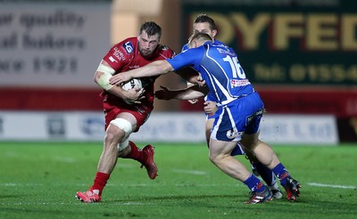 081016 - Scarlets v Newport Gwent Dragons - Guinness PRO12 - Morgan Allen of Scarlets is tackled by Darran Harris of Newport Gwent Dragons