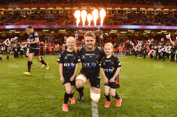 150417 - Newport Gwent Dragons v Scarlets - Guinness PRO12 - Lewis Evans of Newport Gwent Dragons runs out with mascots