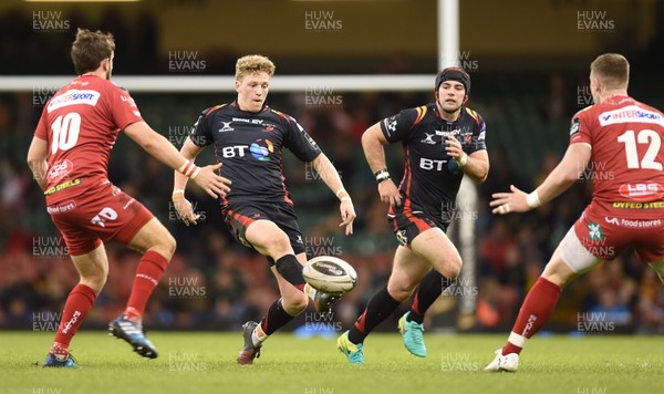 150417 - Newport Gwent Dragons v Scarlets - Guinness PRO12 - Angus O'Brien of Newport Gwent Dragons chips through