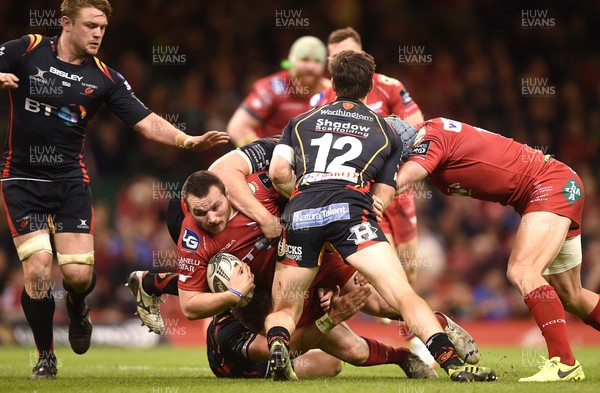 150417 - Newport Gwent Dragons v Scarlets - Guinness PRO12 - Ken Owens of Scarlets is tackled by Carl Meyer of Newport Gwent Dragons