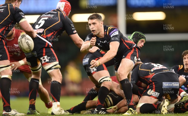 150417 - Newport Gwent Dragons v Scarlets - Guinness PRO12 - Charlie Davies of Newport Gwent Dragons gets the ball away