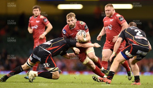 150417 - Newport Gwent Dragons v Scarlets - Guinness PRO12 - John Barclay of Scarlets is tackled by Cory Hill of Newport Gwent Dragons