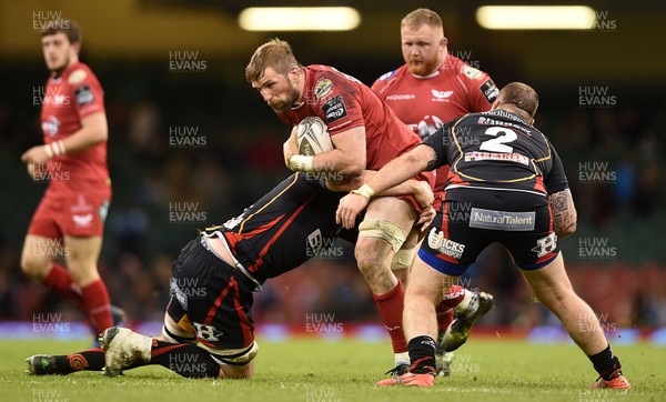 150417 - Newport Gwent Dragons v Scarlets - Guinness PRO12 - John Barclay of Scarlets is tackled by Cory Hill of Newport Gwent Dragons