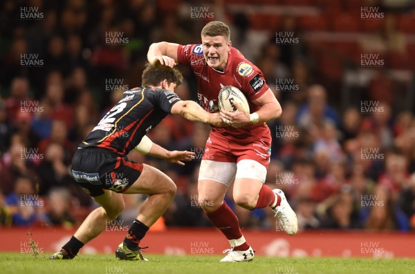 150417 - Newport Gwent Dragons v Scarlets - Guinness PRO12 - Scott Williams of Scarlets takes on Sam Beard of Newport Gwent Dragons