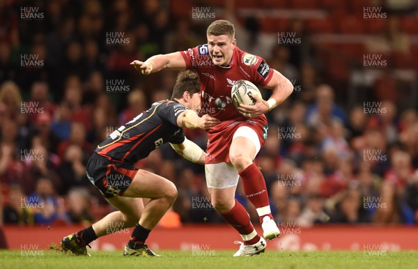 150417 - Newport Gwent Dragons v Scarlets - Guinness PRO12 - Scott Williams of Scarlets takes on Sam Beard of Newport Gwent Dragons