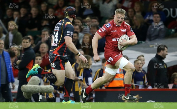 150417 - Newport Gwent Dragons v Scarlets - Guinness PRO12 - James Davies of Scarlets is challenged by Adam Hughes of Newport Gwent Dragons