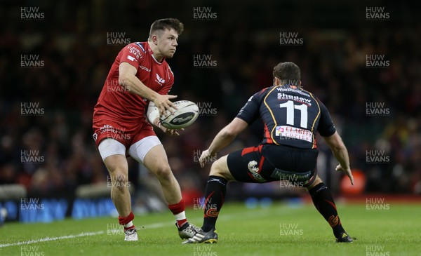 150417 - Newport Gwent Dragons v Scarlets - Guinness PRO12 - Steff Evans of Scarlets is challenged by Adam Warren of Newport Gwent Dragons