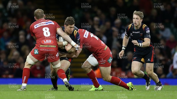 150417 - Newport Gwent Dragons v Scarlets - Guinness PRO12 - Carl Meyer of Newport Gwent Dragons is tackled by John Barclay and Jonathan Davies of Scarlets