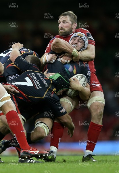 150417 - Newport Gwent Dragons v Scarlets - Guinness PRO12 - Ollie Griffiths of Newport Gwent Dragons is tackled by John Barclay of Scarlets