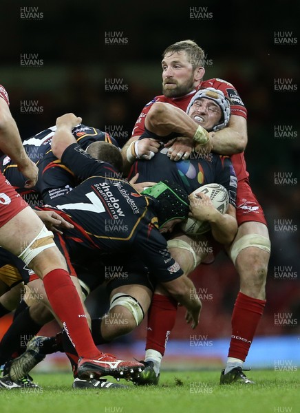 150417 - Newport Gwent Dragons v Scarlets - Guinness PRO12 - Ollie Griffiths of Newport Gwent Dragons is tackled by John Barclay of Scarlets