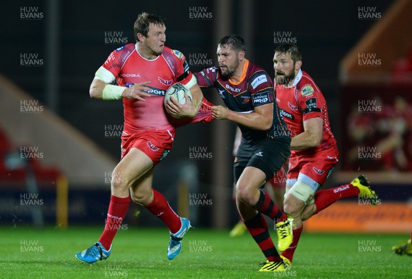 301015 - Scarlets v Newport Gwent Dragons - Guinness PRO12 -Hadleigh Parkes of Scarlets is tackled by Charlie Davies of Newport Gwent Dragons