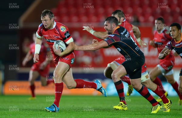 301015 - Scarlets v Newport Gwent Dragons - Guinness PRO12 -Hadleigh Parkes of Scarlets is tackled by Charlie Davies of Newport Gwent Dragons