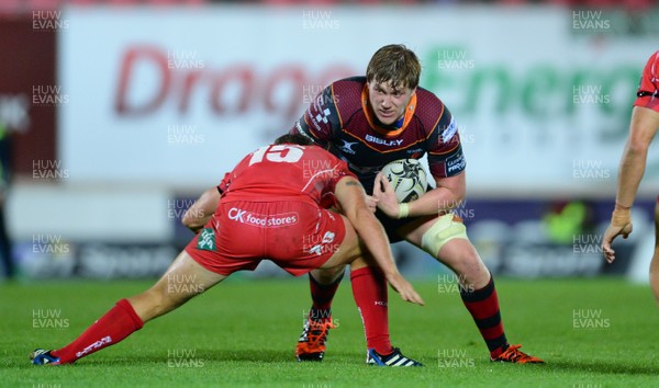 301015 - Scarlets v Newport Gwent Dragons - Guinness PRO12 -Matthew Screech of Newport Gwent Dragons is tackled by Aled Thomas of Scarlets