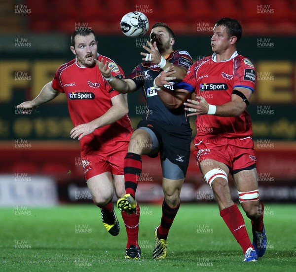 301015 - Scarlets v Newport Gwent Dragons - Guinness PRO12 - Dorian Jones of Newport Gwent Dragons wins the ball from Ken Owens and Aaron Shingler of Scarlets