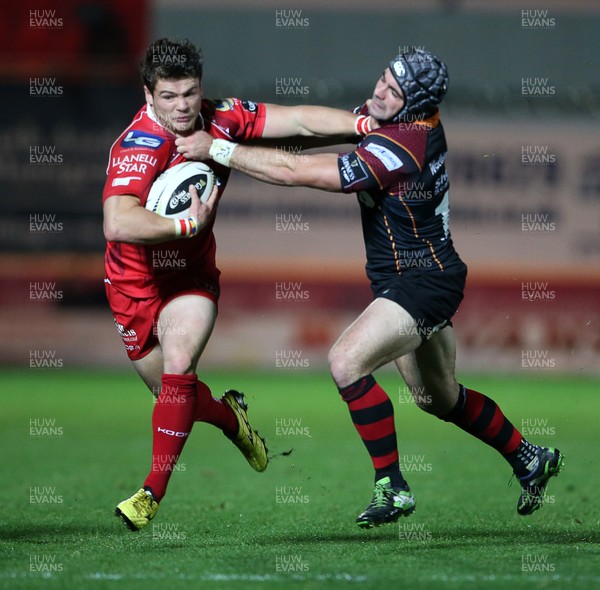 301015 - Scarlets v Newport Gwent Dragons - Guinness PRO12 - Harry Robinson of Scarlets is tackled by Adam Hughes of Newport Gwent Dragons