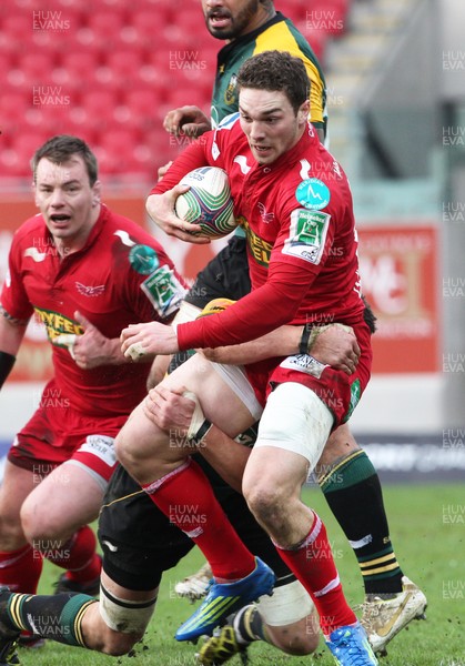 14.01.12 Scarlets v Northampton... Scarlets George North is tackled by Phil Dowson.  