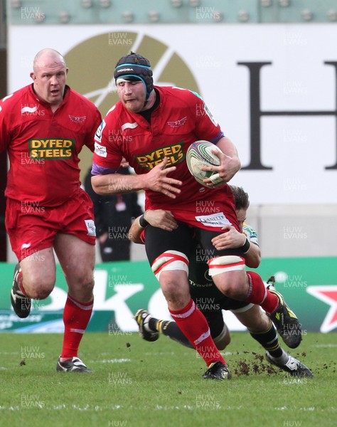 14.01.12 Scarlets v Northampton... Scarlets Ben Morgan is tackled by Stephen Myler.  