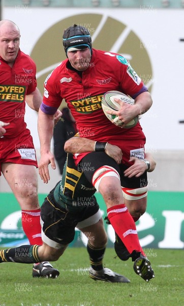 14.01.12 Scarlets v Northampton... Scarlets Ben Morgan is tackled by Stephen Myler.  