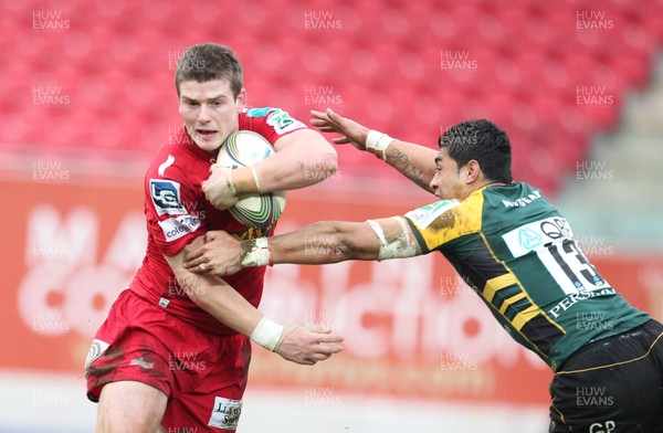 14.01.12 Scarlets v Northampton... Scarlets Scott Williams beats tackle by George Pisi.  