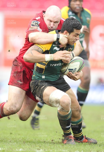 14.01.12 Scarlets v Northampton... Saints George Pisi is tackled by Iestyn Thomas.  