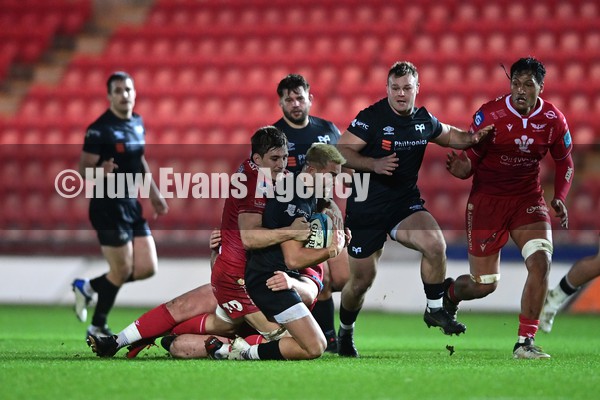 010122 - Scarlets v Ospreys - United Rugby Championship - Rhys Webb of the Ospreys is tackled by Tomas Lezana of the Scarlets   