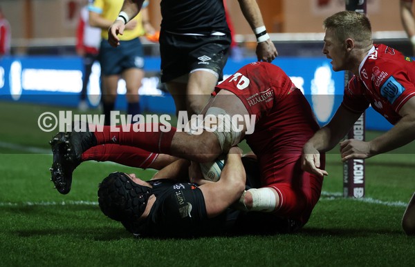 010122 - Scarlets v Ospreys - United Rugby Championship - Dan Evans of Ospreys try is held up by Tom Price of Scarlets