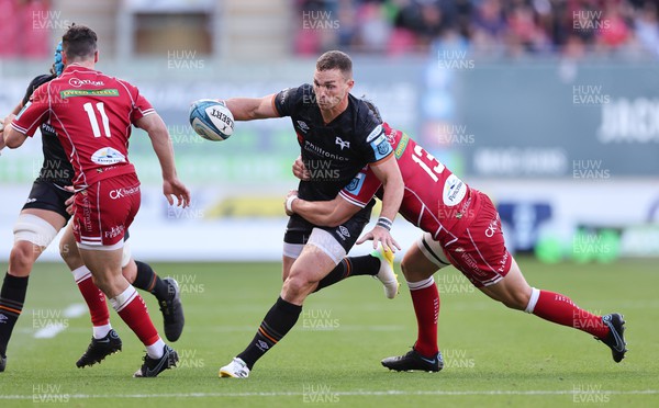 170922 - Scarlets v Ospreys, United Rugby Championship - George North of Ospreys is tackled by Jonathan Davies of Scarlets