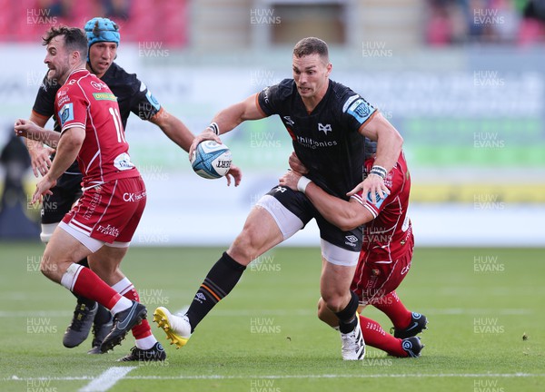170922 - Scarlets v Ospreys, United Rugby Championship - George North of Ospreys is tackled by Jonathan Davies of Scarlets