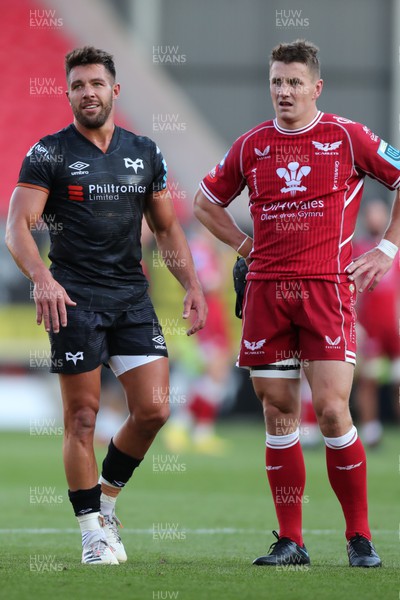 170922 - Scarlets v Ospreys - United Rugby Championship - Rhys Webb of Ospreys and Jonathan Davies Scarlets Captain look at the big screen 