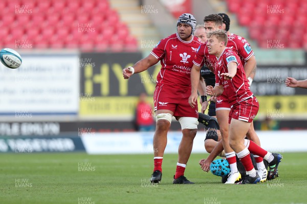 170922 - Scarlets v Ospreys - United Rugby Championship - Sam Costelow of Scarlets gets the ball away