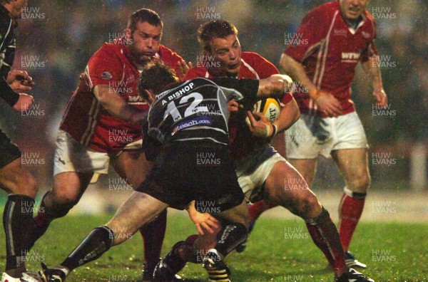 24.04.07 - Llanelli Scarlets v Ospreys - Magners League - Llanelli's Matthew Rees is tackled by Andrew Bishop 