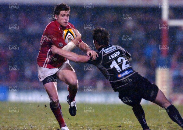 24.04.07 - Llanelli Scarlets v Ospreys - Magners League - Llanelli's Gavin Evans is tackled by Andrew Bishop 