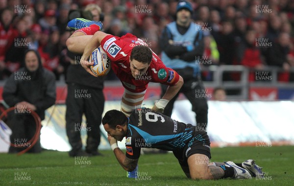 26.12.11 - Scarlets v Ospreys - RaboDirect PRO12 - George North of Scarlets is tackled by \Kahn Fotuali'i of Ospreys. 