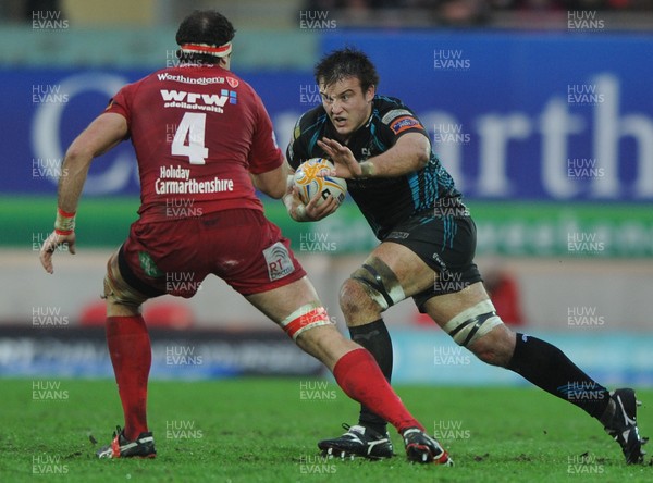 26.12.11 - Scarlets v Ospreys - RaboDirect PRO12 - Tom Smith of Ospreys is tackled by Lou Reed of Scarlets. 