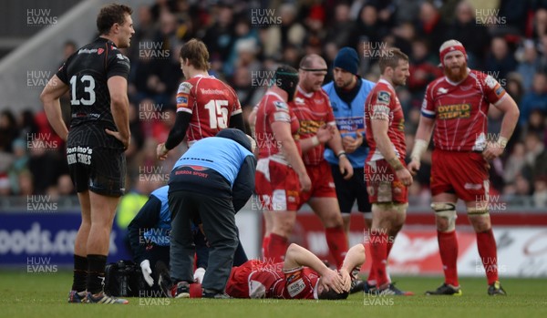 261213 - Scarlets v Ospreys - RaboDirect PRO12 -Ken Owens of Scarlets is treated