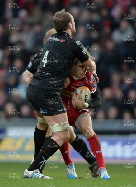 261213 - Scarlets v Ospreys - RaboDirect PRO12 -Liam Williams of Scarlets is tackled by Alun Wyn Jones of Ospreys