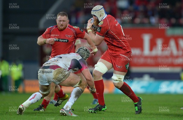 261215 - Scarlets v Ospreys - Guinness PRO12 -Jake Ball of Scarlets is tackled by Dan Lydiate of Ospreys