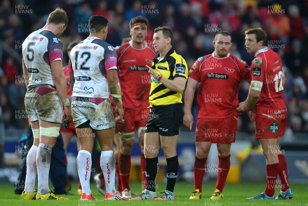 261215 - Scarlets v Ospreys - Guinness PRO12 -Referee Nigel Owens talks to Josh Matavesi of Ospreys