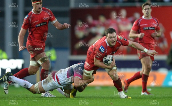 261215 - Scarlets v Ospreys - Guinness PRO12 -Jack Condy of Scarlets is tackled by Justin Tipuric of Ospreys