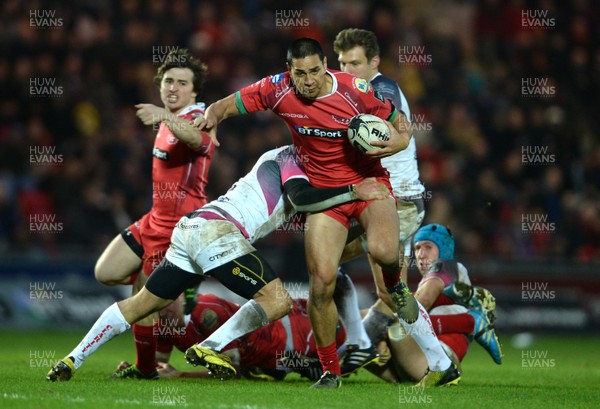 261215 - Scarlets v Ospreys - Guinness PRO12 -Regan King of Scarlets is tackled by Hanno Dirksen of Ospreys