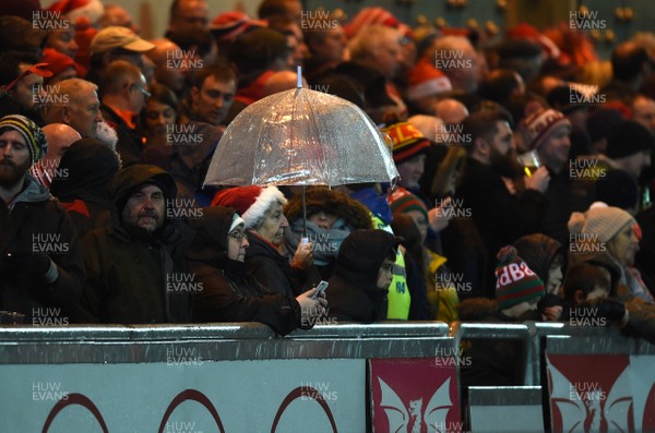 261217 - Scarlets v Ospreys - Guinness PRO14 - Fans shelter from the rain