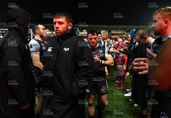 261219 - Scarlets v Ospreys - Guinness PRO14 - Ospreys players look dejected at the end of the game