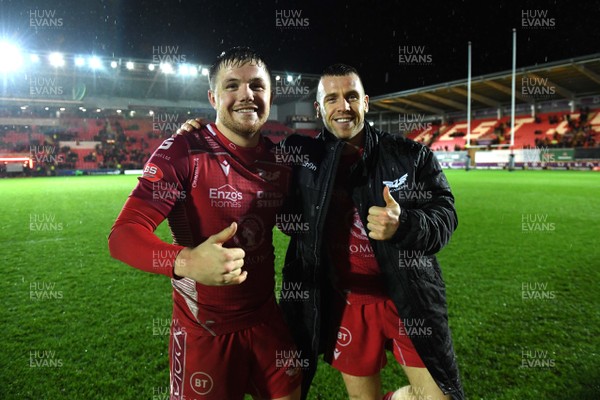261219 - Scarlets v Ospreys - Guinness PRO14 - Steff Evans and Gareth Davies of Scarlets at the end of the game