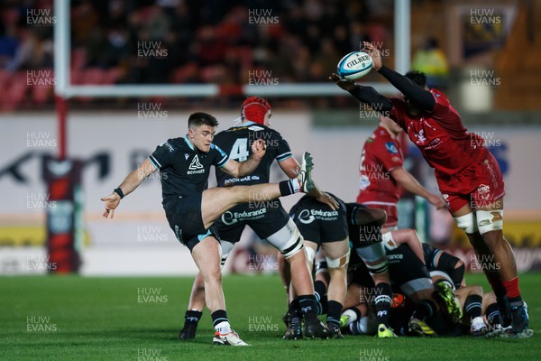 261223 - Scarlets v Ospreys - United Rugby Championship - Reuben Morgan-Williams of Ospreys has his kick charged down by Sam Lousi of Scarlets