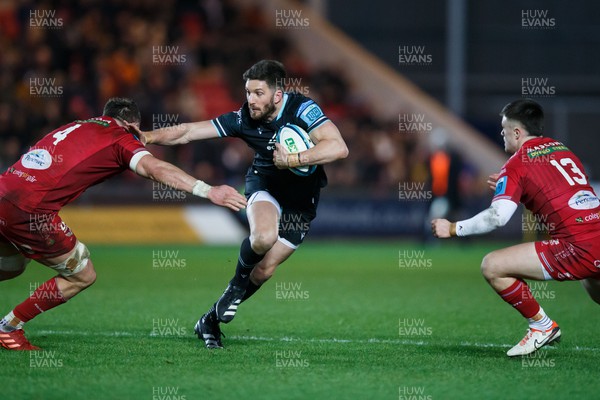 261223 - Scarlets v Ospreys - United Rugby Championship - Owen Williams of Ospreys takes on Alex Craig of Scarlets
