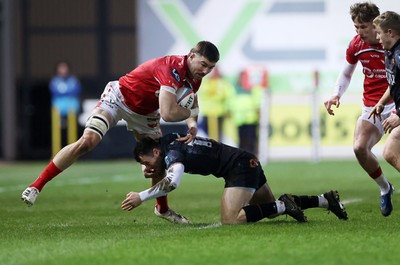 261225 - Scarlets v Ospreys - United Rugby Championship - Max Douglas of Scarlets is tackled by Ryan Conbeer of Ospreys 