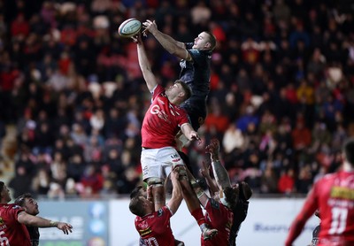 261225 - Scarlets v Ospreys - United Rugby Championship - Taine Plumtree of Scarlets and Huw Sutton of Ospreys 