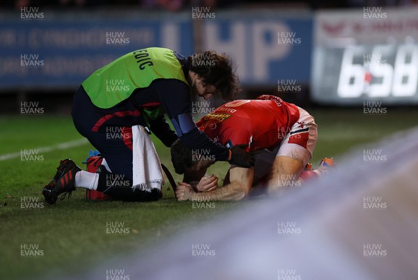 261225 - Scarlets v Ospreys - United Rugby Championship - Gareth Davies of Scarlets collides with the advertising boards