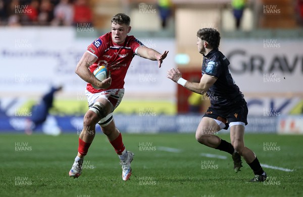 261225 - Scarlets v Ospreys - United Rugby Championship - Taine Plumtree of Scarlets is tackled by Dan Edwards of Ospreys 